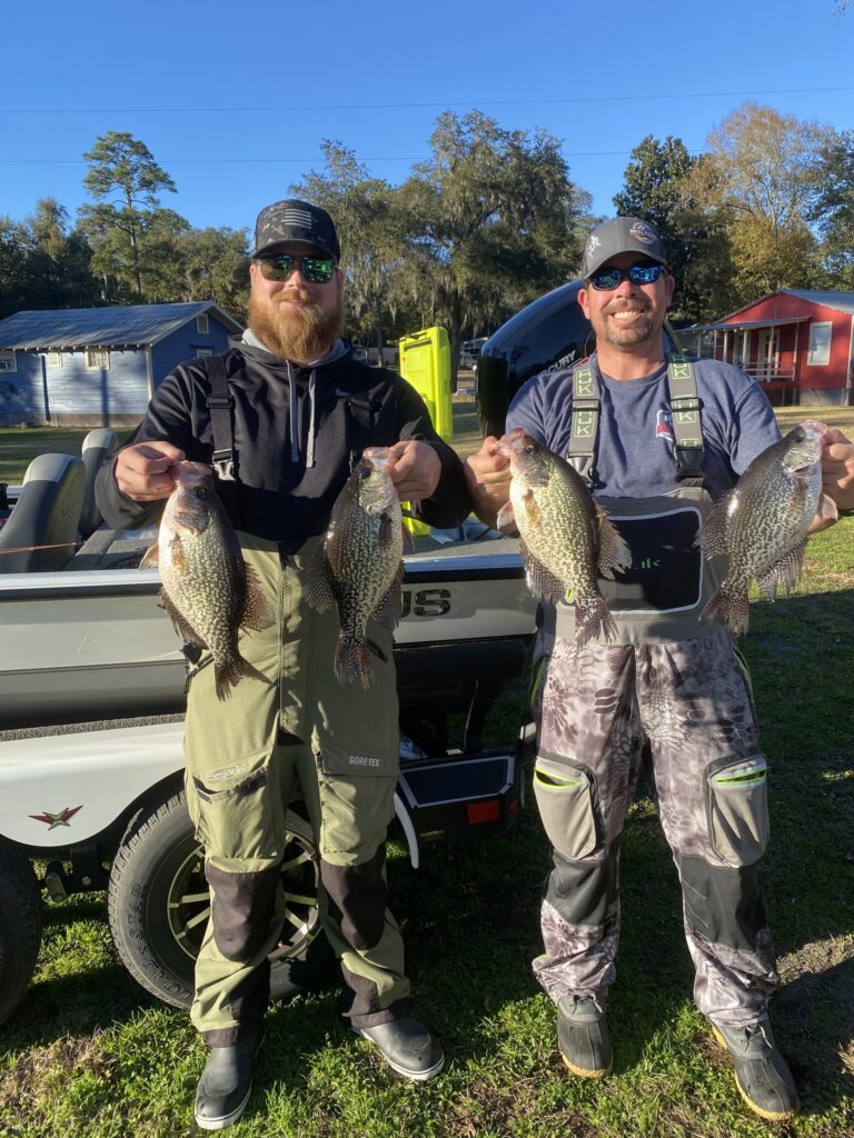 Two Delta Jig Co. anglers holding crappie after a tournament